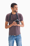 Smiling man with camera around his neck