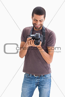 Stylish man with camera around his neck