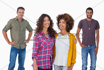Fashionable young friends smiling at camera