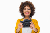 Happy girl holding a camera