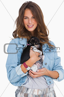Smiling woman with her chihuahua