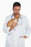 Worried vet holding chihuahua