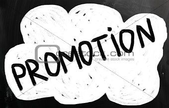 "promotion" handwritten with white chalk on a blackboard