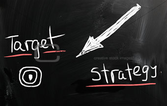 "Strategy" handwritten with white chalk on a blackboard