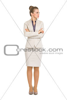 Full length portrait of business woman looking on copy space