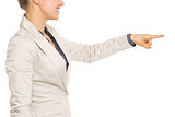 Closeup on business woman pointing in corner