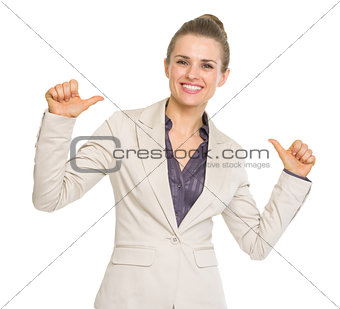 Smiling business woman pointing on herself