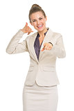 Happy business woman showing contact me gesture