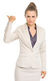 Serious business woman showing get out gesture