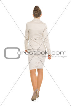 Full length portrait of happy business woman going straight . re