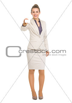 Full length portrait of smiling business woman showing business 