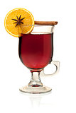 Hot mulled wine with orange slice, anise and cinnamon