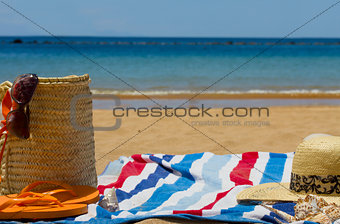 towel and sunbathing accessories on  bech