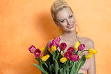 Blonde woman with colourful bouquet 