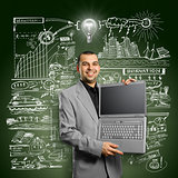 Idea Concept businessman with open laptop in his hands