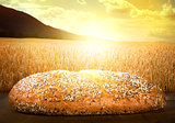 Bread and wheat cereal crops at sunset