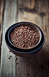 Brown lentils in ceramic bowls