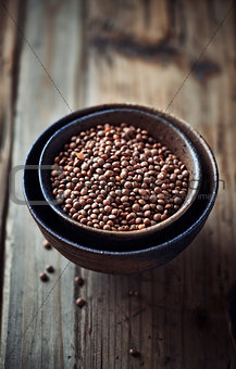 Brown lentils in ceramic bowls