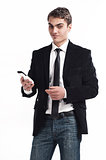 Young happy man holding mobile phone