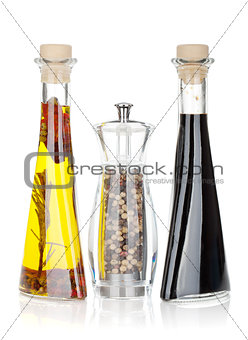 Olive oil, pepper shaker and vinegar