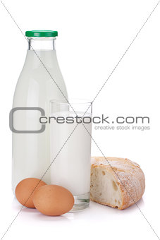 Milk bottle, glass, eggs and bread