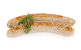 Two grilled sausages with dill