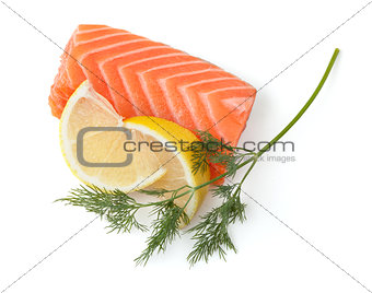 Fresh salmon steak with lemon slices and dill