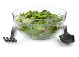 Healthy green salad with plastic utensils