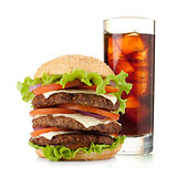 Glass of cola with ice and hamburger