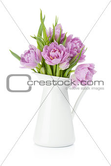 Pink tulips in metal pitcher