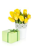 Yellow tulips in a vase and gift box