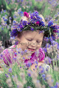 pretty girl among the flowers of lavender