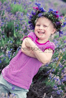 pretty girl among the flowers of lavender
