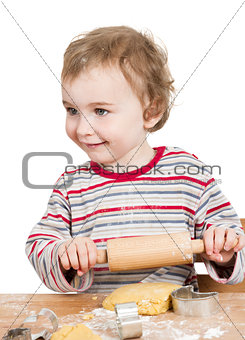 happy young child with rolling pin in white background