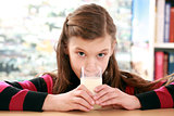 Concept healthy eating with a girl drinking milk