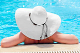Rear view of a woman into the swimming pool