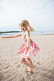 Smiling young girl having fun at beach