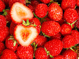 Many strawberries as a texture and sliced berry