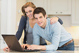 Happy couple on laptop