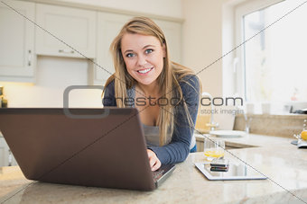 Woman smiling at the laptop