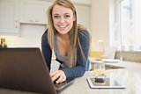 Smiling woman at laptop