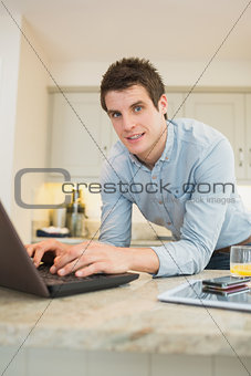 Man enjoying typing at the laptop