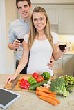 Couple in the kitchen drinking wine