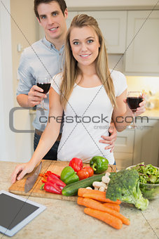 Couple in the kitchen drinking wine