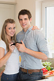 Young couple clinking wine glasses