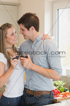 Couple drinking wine and looking into each others eyes