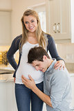 Smiling pregnant woman with  husband