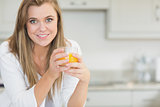 Woman holding an orange juice