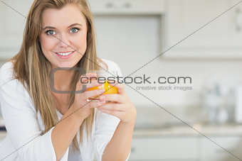 Woman holding an orange juice
