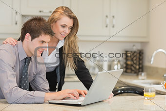 Couple looking at the laptop